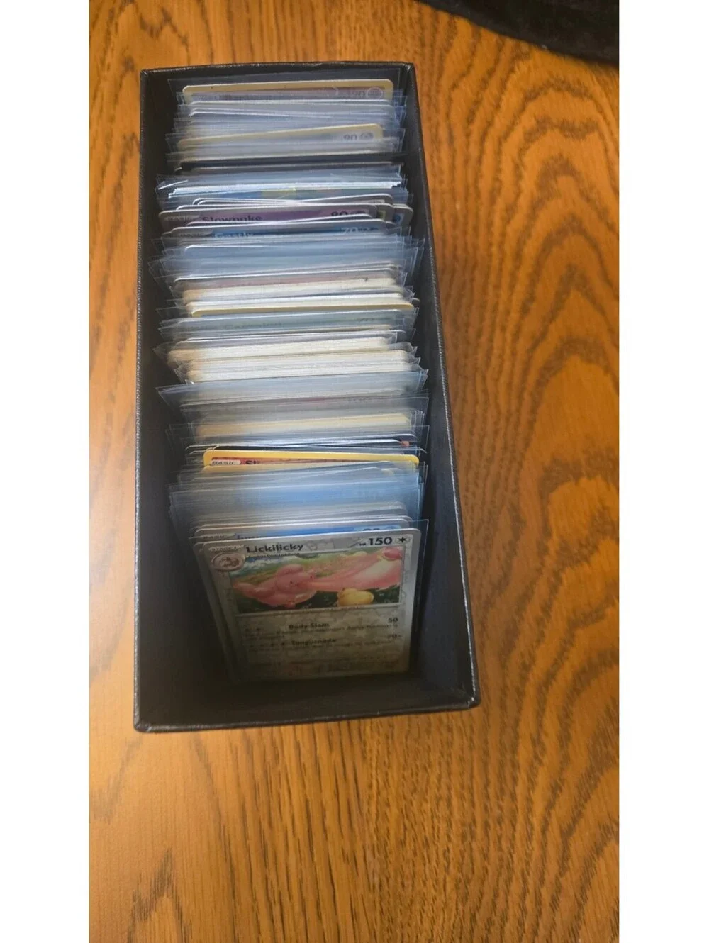Bulk Lot of Mixed Pokemon Trading Cards with Sleeves and Storage Box